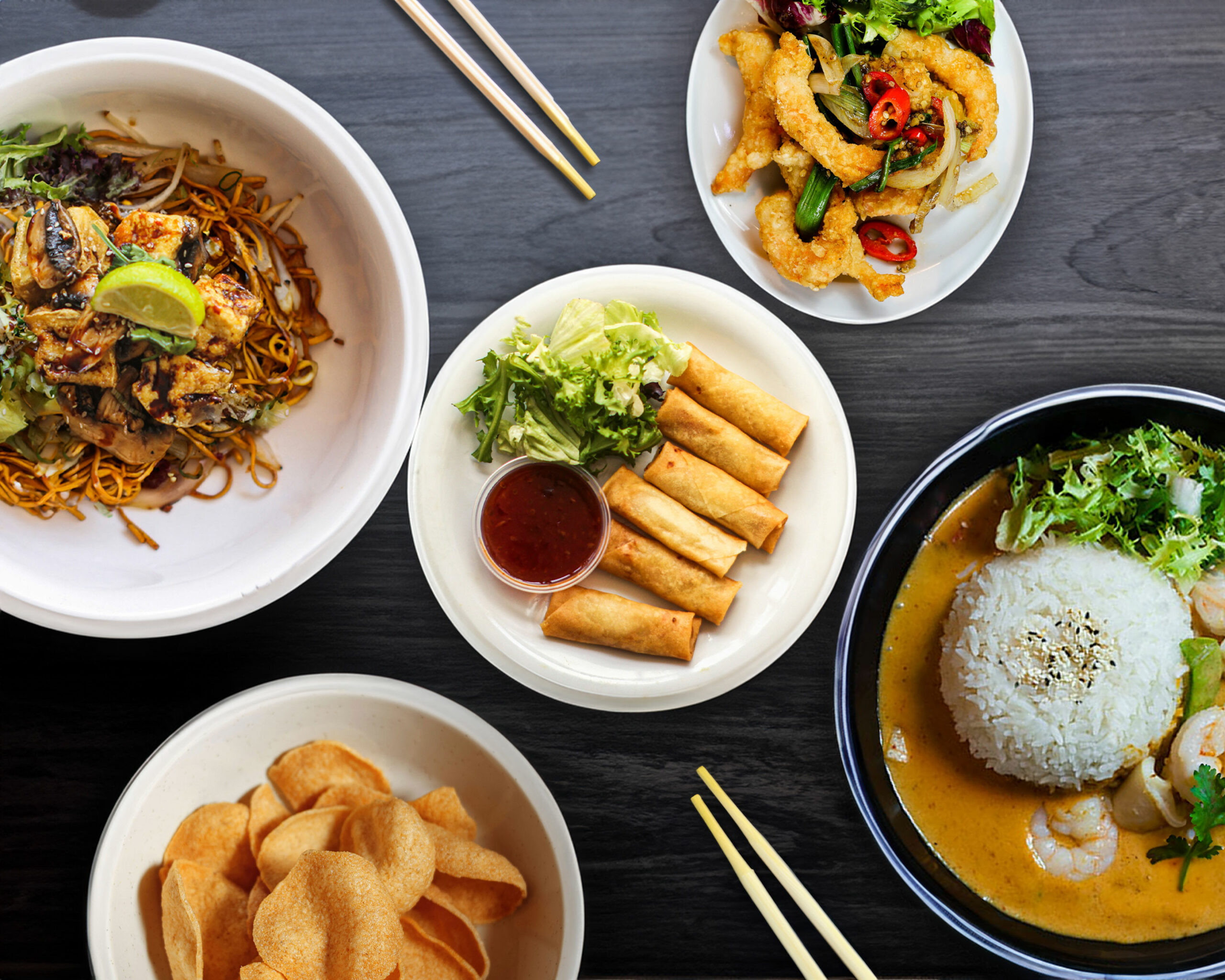 A selection of Asian noodle dishes and chopsticks