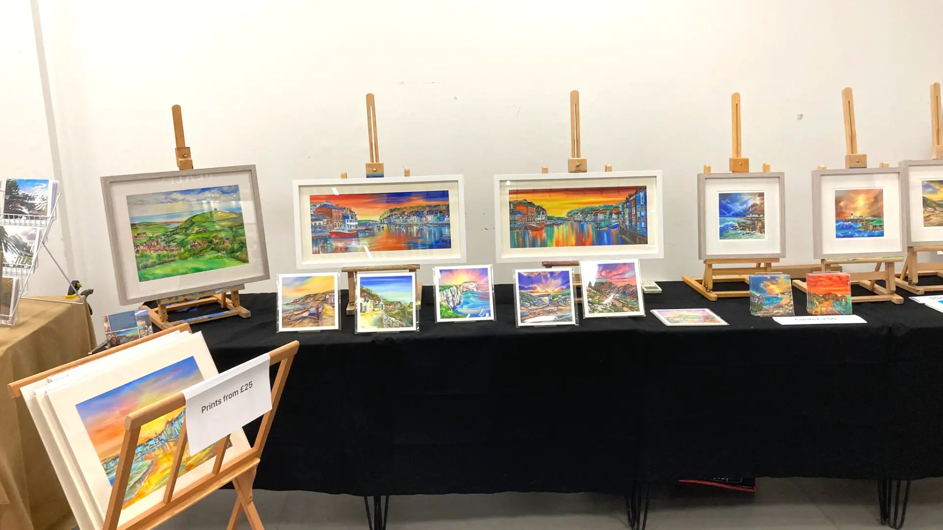 A variety of colourful landscape paintings depicting areas of natural beauty in Dorset